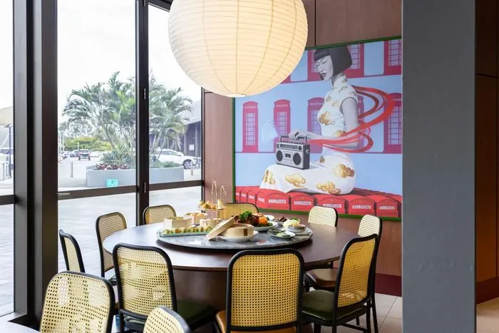 Round marble table in front of contemporary Chinese pop art